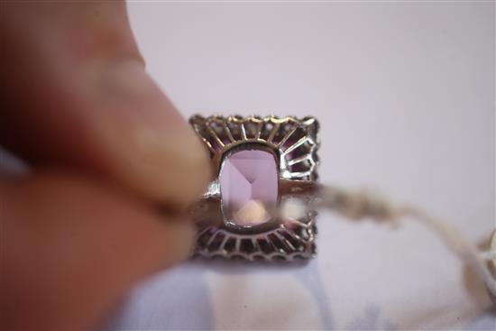 A mid 20th century 18ct white gold, pink sapphire and diamond cluster dress ring, size K.